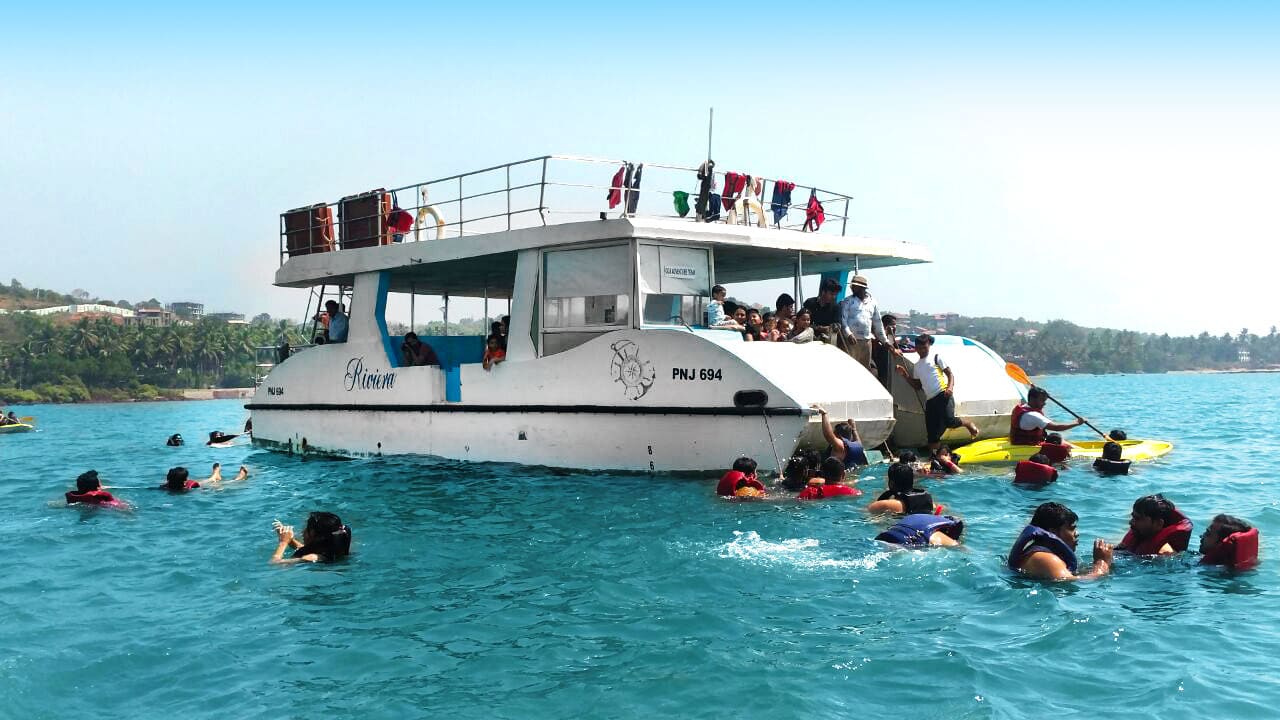 Peoples enjoying a boat party with water sports in Goa